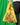 A person holding a yellow checkered reusable bag with plant illustrations and text on it.