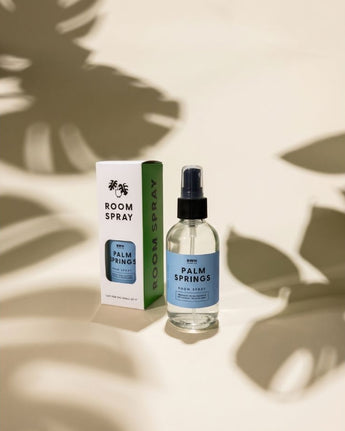 Room spray bottle and packaging with 'Palm Springs' label on a light background