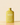 Yellow bottle of Arber bio insecticide on a beige background