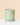 light green eco pot on a beige background