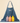 Denim apron with 'BWH Plant Co' logo and three bottles of 'Arber' products on a beige background