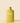Yellow bottle of Arber bio insecticide on a beige background